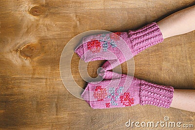 Pink knitted mittens with pattern Stock Photo